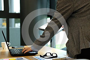 man working with computer. businessman organizing plan with note