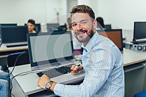 Man working on computer in computer lab