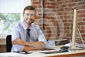 Man Working At Computer In Contemporary Office