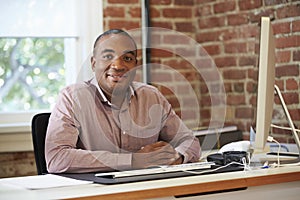 Man Working At Computer In Contemporary Office