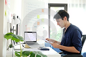 Man working with computer at home office, Working at home, Online learning education