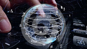 Man working on computer keyboard with graphic of internet networ