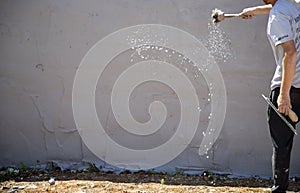 Man working on the construction of the printed concrete wall photo