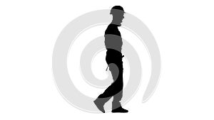 Man working from a construction site comes with a drill in his hands. White background. Silhouette. Side view
