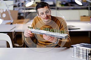 Man working with maquette in design and engineering architecture