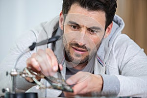 man working on desk top computer photo