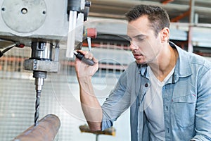 man working with drill machine