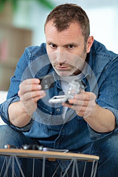 Man working on drone in garage