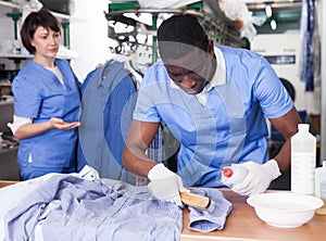 Man working in dry cleaner