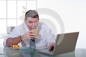 Man working and eat unhealt food