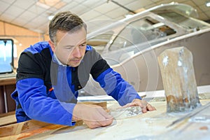 man working with fibreglass photo