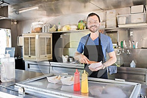 Man working in a food stand