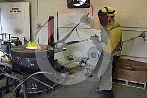 Man Working in the Foundry Hot Furnace photo