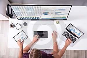 Man Working In Front Of Blank Screen Computer