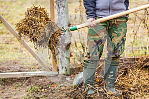 Man working in garden with fork