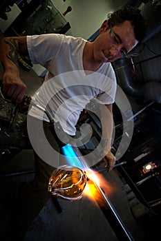 Man Forming Vase with Blowtorch photo