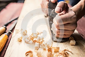 Man working with hand jack plane