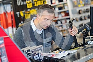 Man working hardware store photo