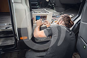 Man working on his camper van conversion