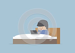 Man working on his laptop in the bed