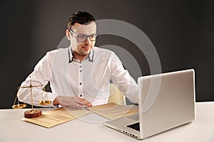 Man working on his laptop. Lawyer concept.