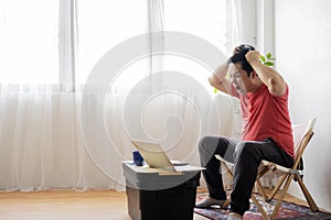 Man working at home, can`t make financial or annual report