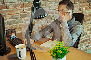 Man working from home during coronavirus or COVID-19 quarantine, remote office concept