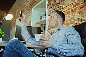 Man working from home during coronavirus or COVID-19 quarantine, remote office concept