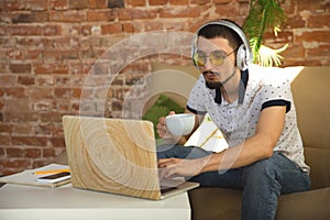 Man working from home during coronavirus or COVID-19 quarantine, remote office concept