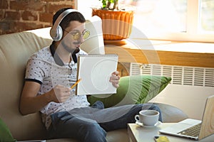 Man working from home during coronavirus or COVID-19 quarantine, remote office concept