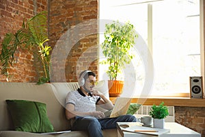 Man working from home during coronavirus or COVID-19 quarantine, remote office concept