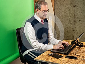 Man working from home in his basement on a virutal meeting