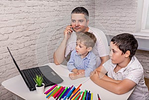 Man working from home with laptop during quarantine. Freelance job