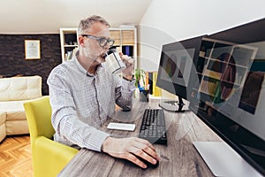 Man working from home office using computer