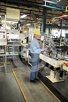 Man Working in Industrial Manufacturing Factory