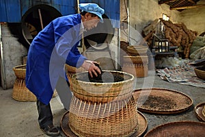 ANHUI PROVINCE, CHINA Ã¢â¬â CIRCA OCTOBER 2017: Men working inside a tea factory