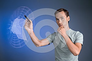 Man working with interactive Sci-Fi HUD interface.