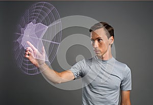 Man working with interactive Sci-Fi HUD interface.