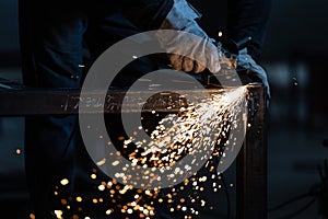 Man working on iron with grinder