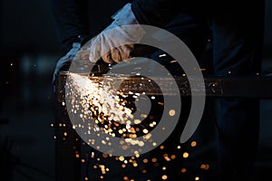 Man working on iron with grinder