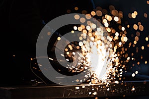 Sparkles and fire from grinder cutting