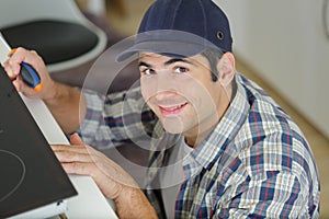 man working on kitchen top