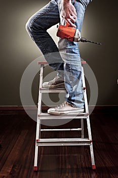 Man working on ladder