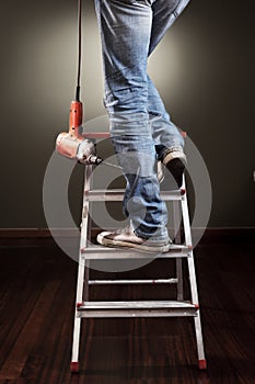 Man working on ladder