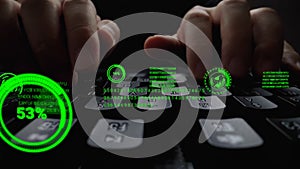 Man working on laptop computer keyboard with graphic user interface GUI hologram