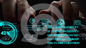 Man working on laptop computer keyboard with graphic user interface GUI hologram