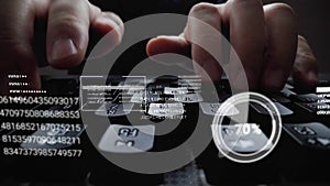 Man working on laptop computer keyboard with graphic user interface GUI hologram