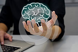 Man working on laptop with holding brain illustration. Future technology.