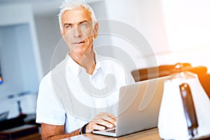 Man working on laptop at home