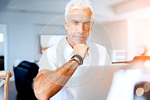 Man working on laptop at home